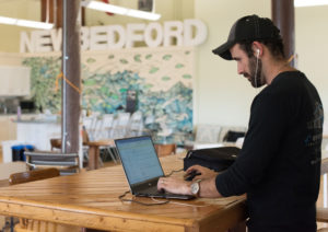 man working at a standing desk at Groundwork