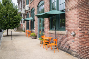 exterior entrance to coworking space with outdoor seating