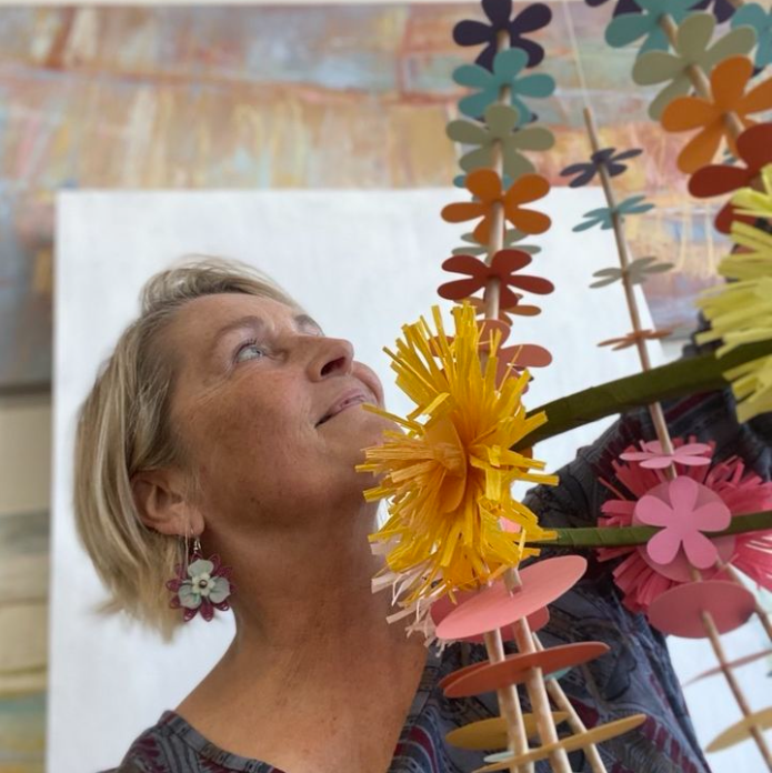Alyn Carlson with her paper flower art