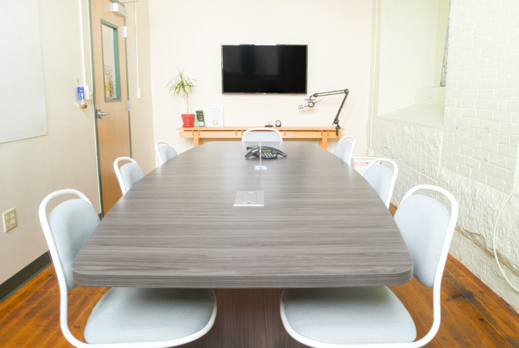 the shuttle conference room to take clients in a coworking space