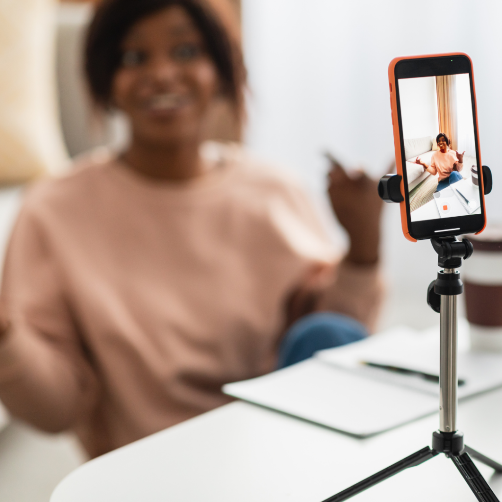 woman recording on phone for social media 